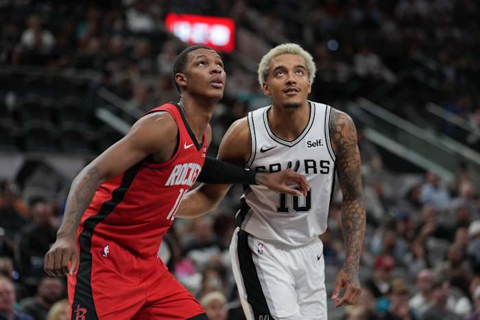 Oct 18, 2023; San Antonio, Texas, USA; Houston Rockets center Jock Landale (11) and San Antonio Spurs forward Jeremy Sochan (10) look for a rebound in the first half at the Frost Bank Center.